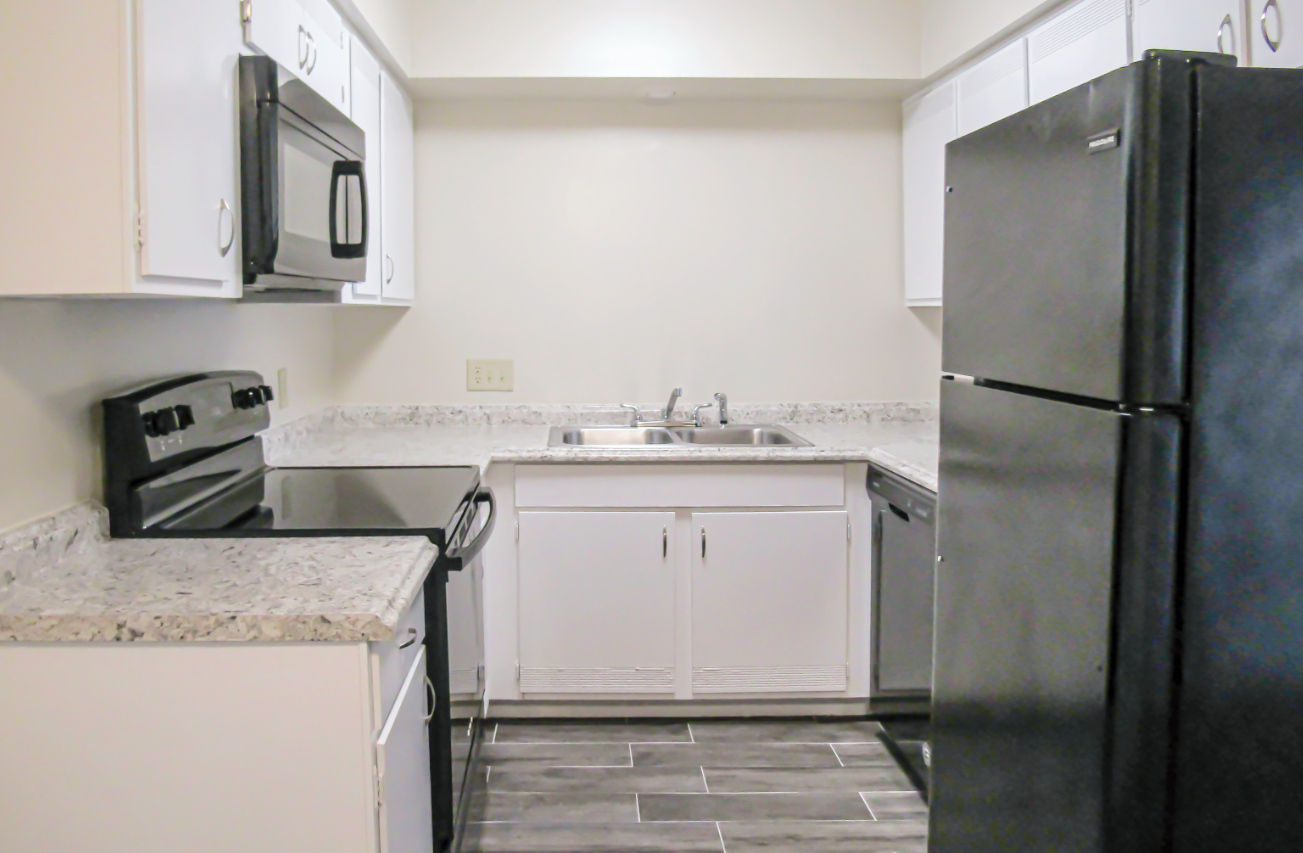 Image of a fully-equipped kitchen with energy-efficient appliances at Chouteau Heights