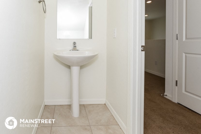 a small bathroom with a sink and a mirror