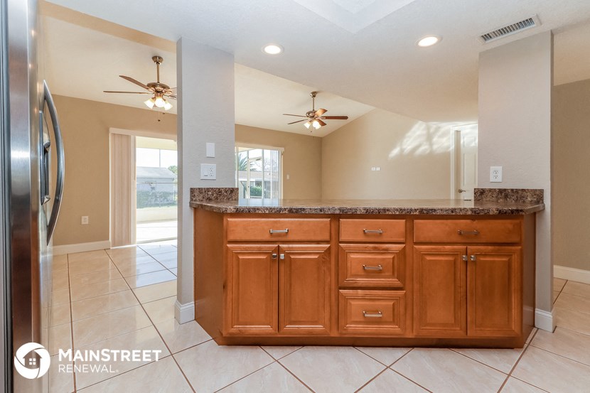 a kitchen with wooden cabinets and a counter top