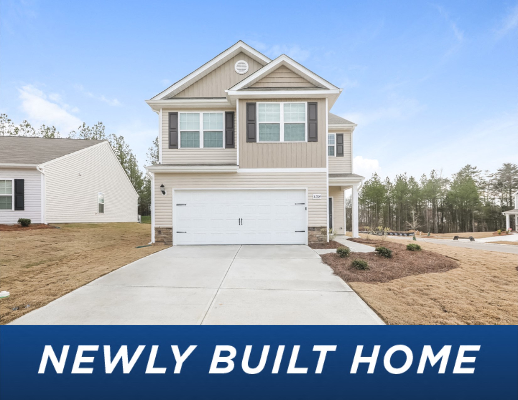 a new build home with a driveway in front of it