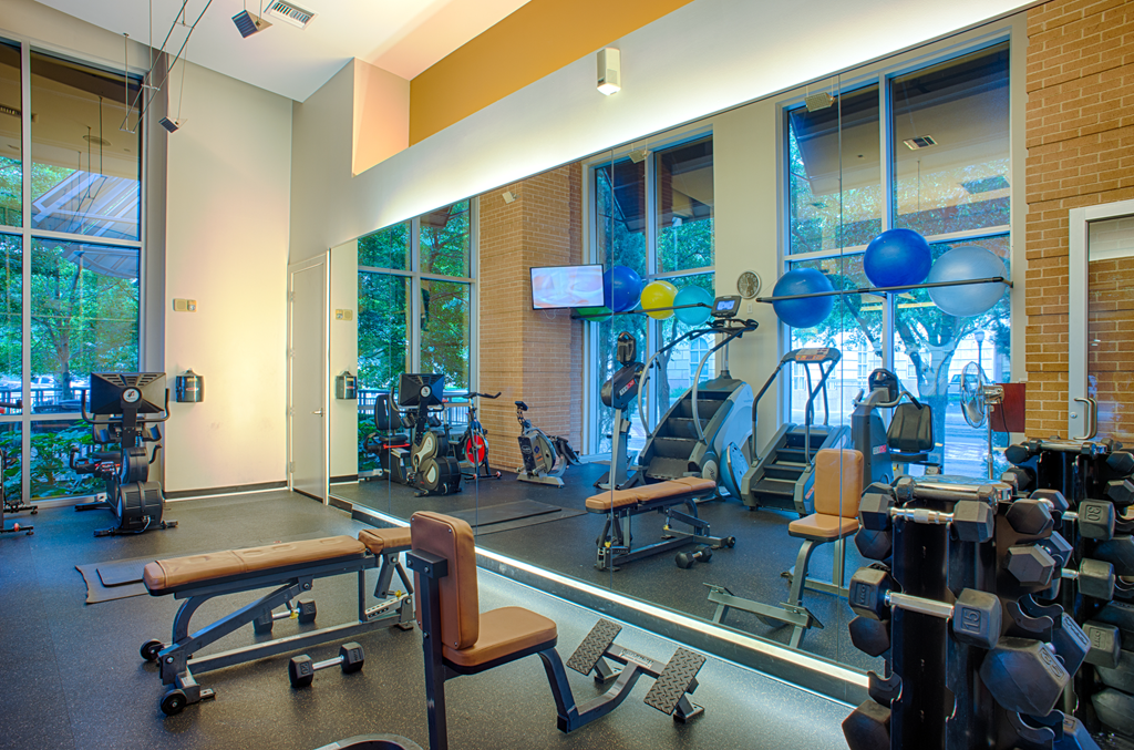 Uptown Dallas apartments with fitness center equipped with weight training and cardio equipment