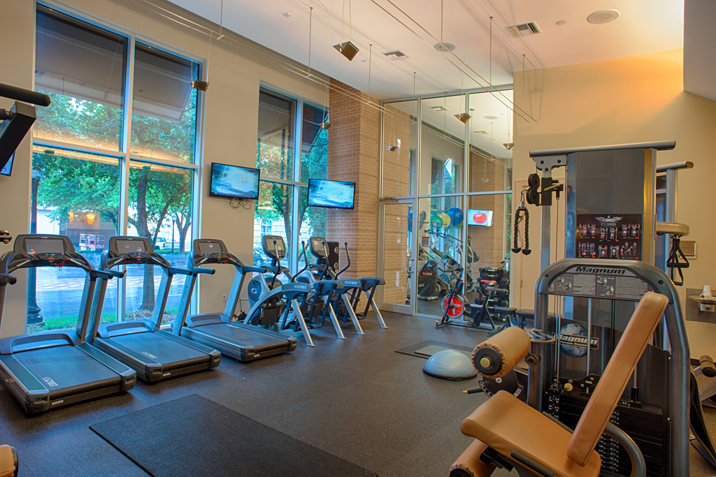 Uptown Dallas apartments with fitness center equipped with weight training and cardio equipment