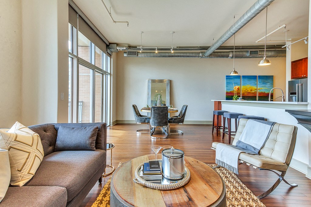 Spacious open concept floor plans with large living room and dining area with hardwood style flooring