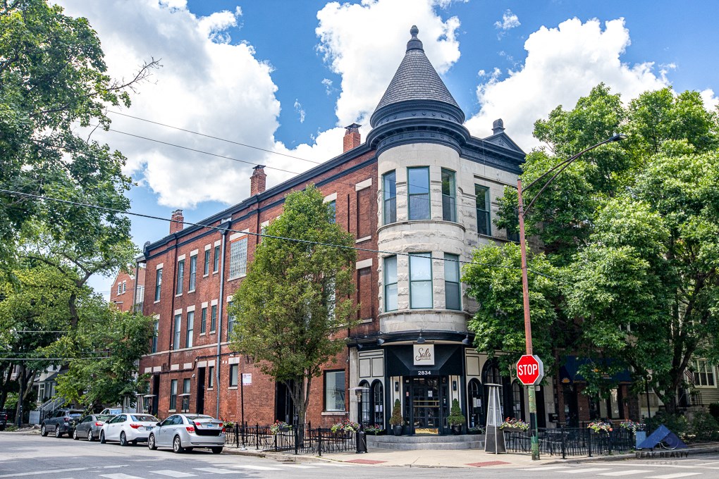 a building with a turret on the corner of a street