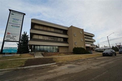 a large building sitting on the side of a street