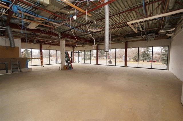 a large empty room with windows in a building