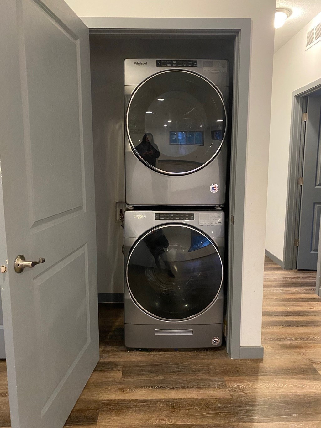 a washer and dryer stacked on top of each other in a laundry room