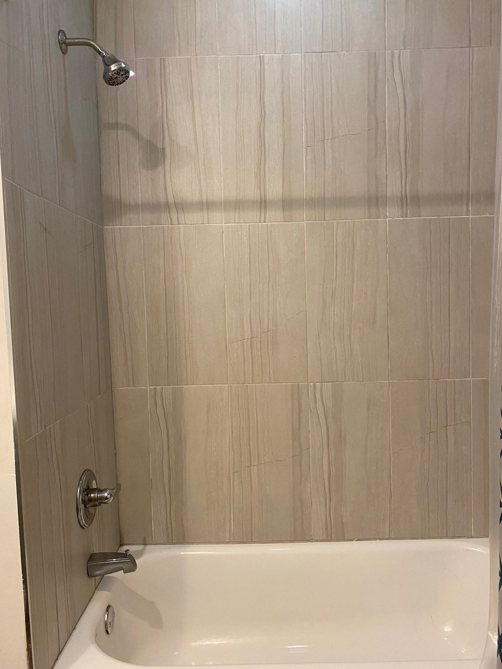 a bathroom with a shower and a bath tub