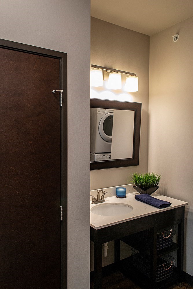 a small bathroom with a sink and a mirror