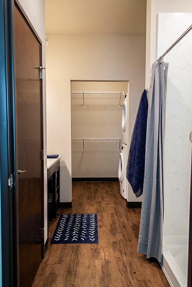 a small bathroom with a shower and a towel