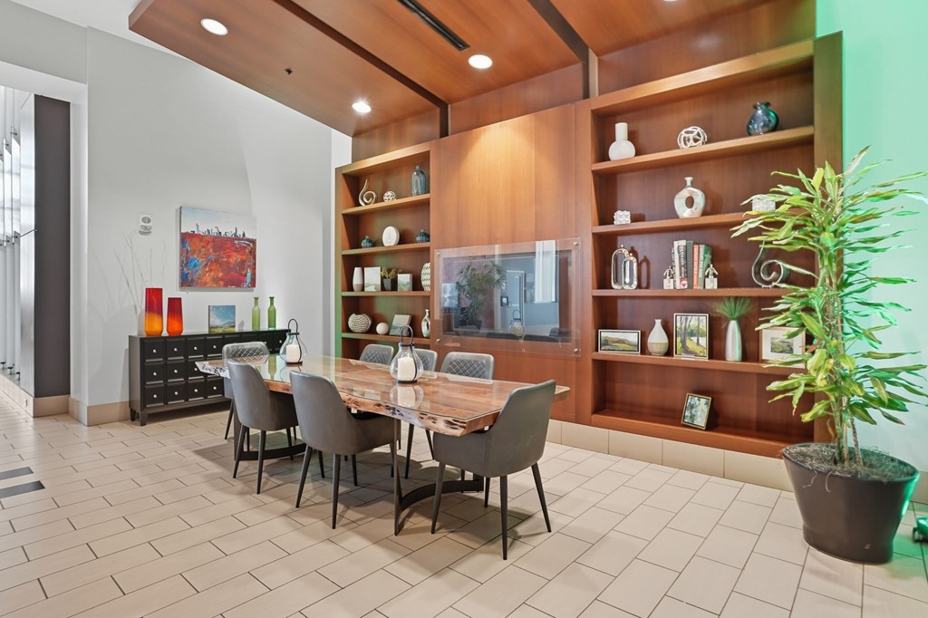 A dining room with a table set for six.