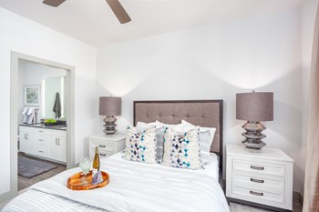Large bedroom with ceiling fan and attached bathroom