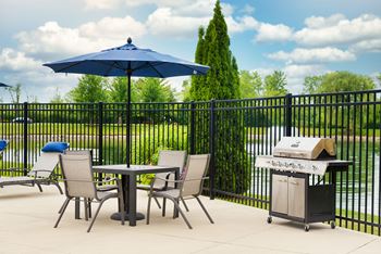 poolside grilling station and dining area