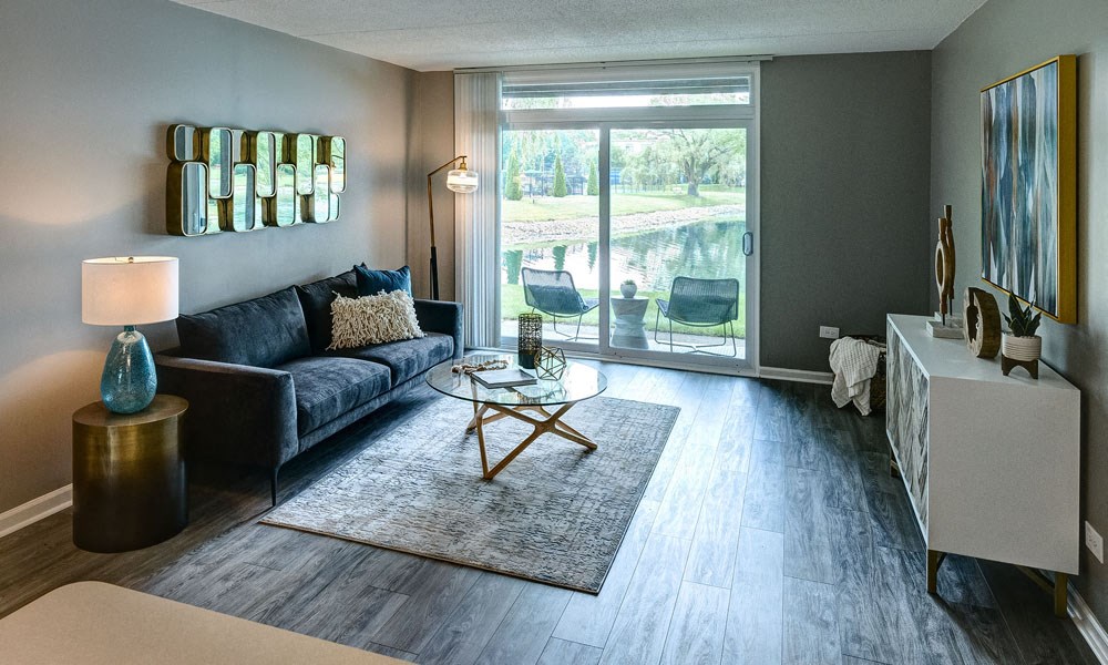 Living Room With Private Balcony at Foxboro Apartments, Wheeling