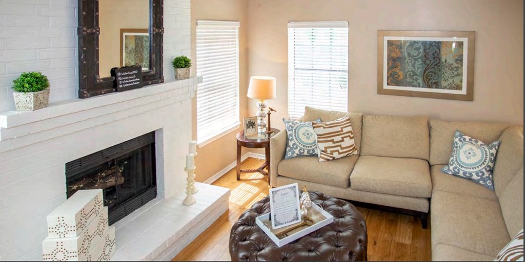 a living room with a couch and a fireplace