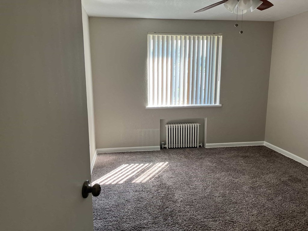 a room with a radiator and a window