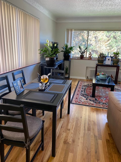 a dining room with a table and chairs