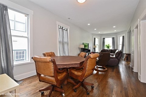 a dining room with a table and chairs