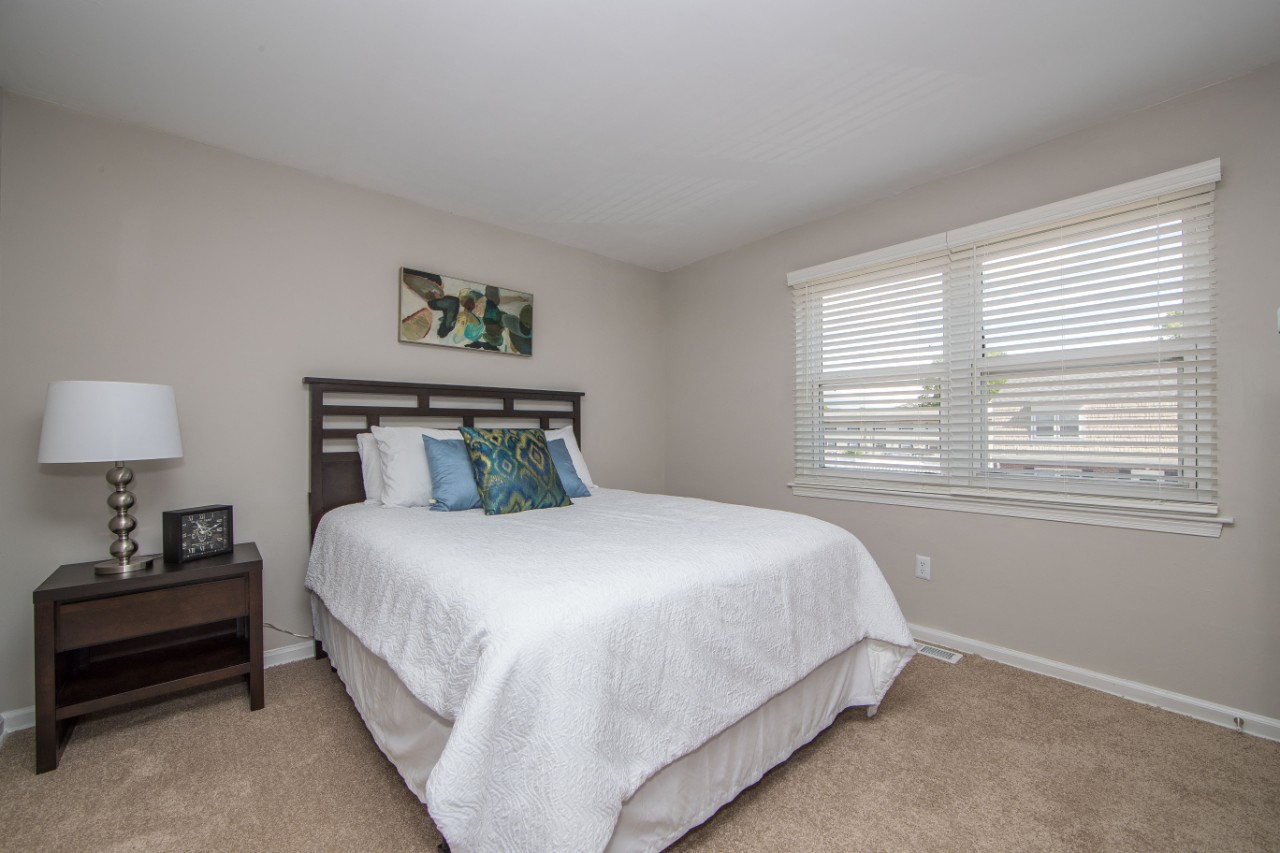 Carpeted bedroom at Villages at City Center apartments in Newport News VA