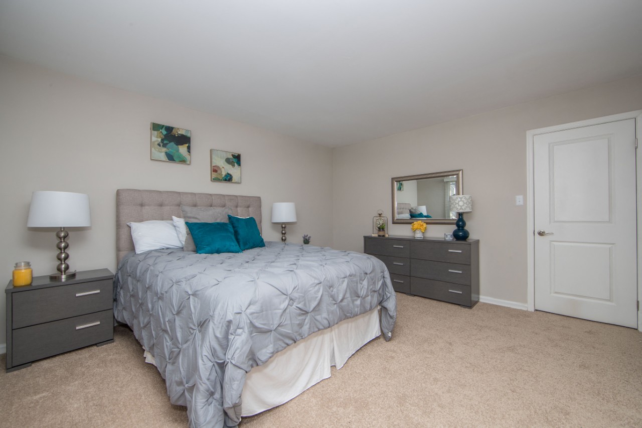 Carpeted bedroom at Villages at City Center apartments in Newport News VA