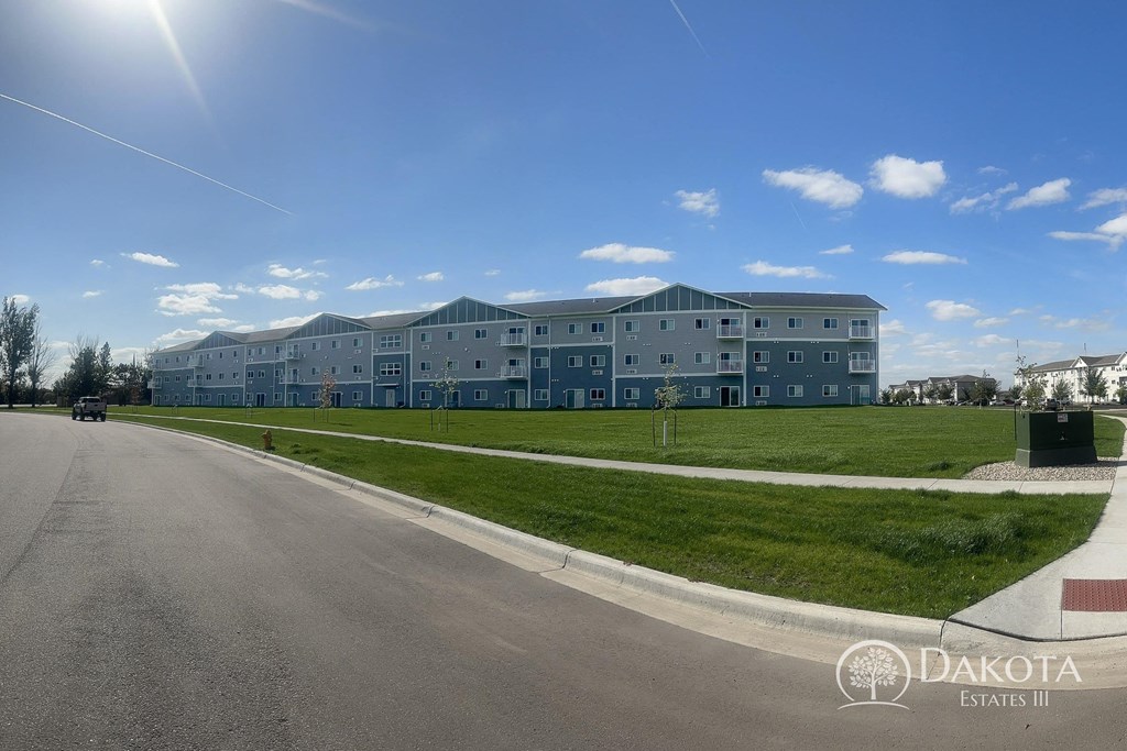 a view of an apartment building from the street
