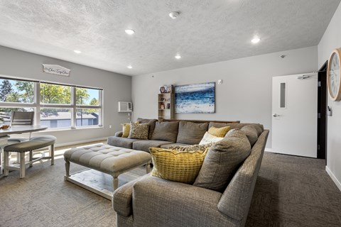 a living room with a couch and a table