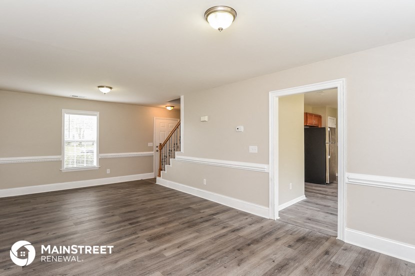 the living room and dining room are spacious and open to the hallway