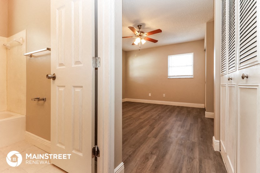 the living room is open to the bedroom and bathroom