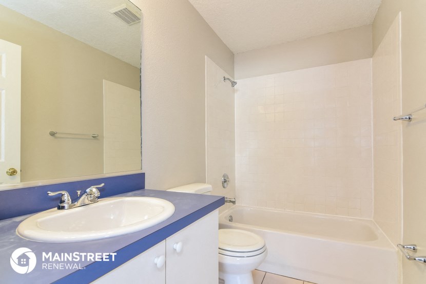 a bathroom with a sink toilet and a shower