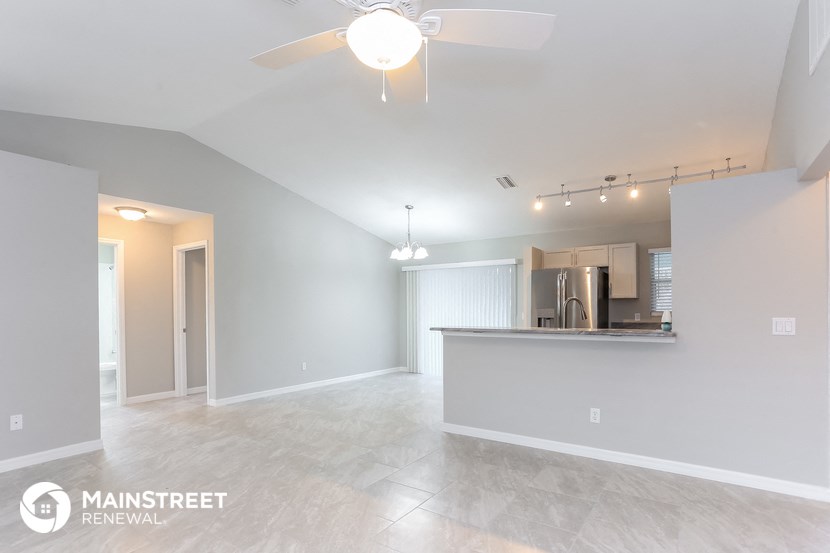 the spacious living room and kitchen in this manufactured home