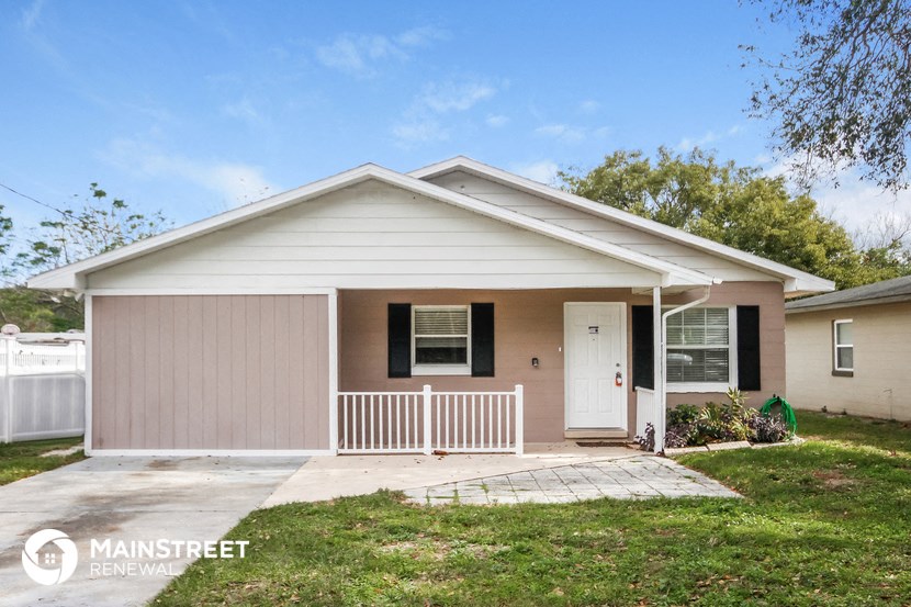 a white house with a porch and a white door