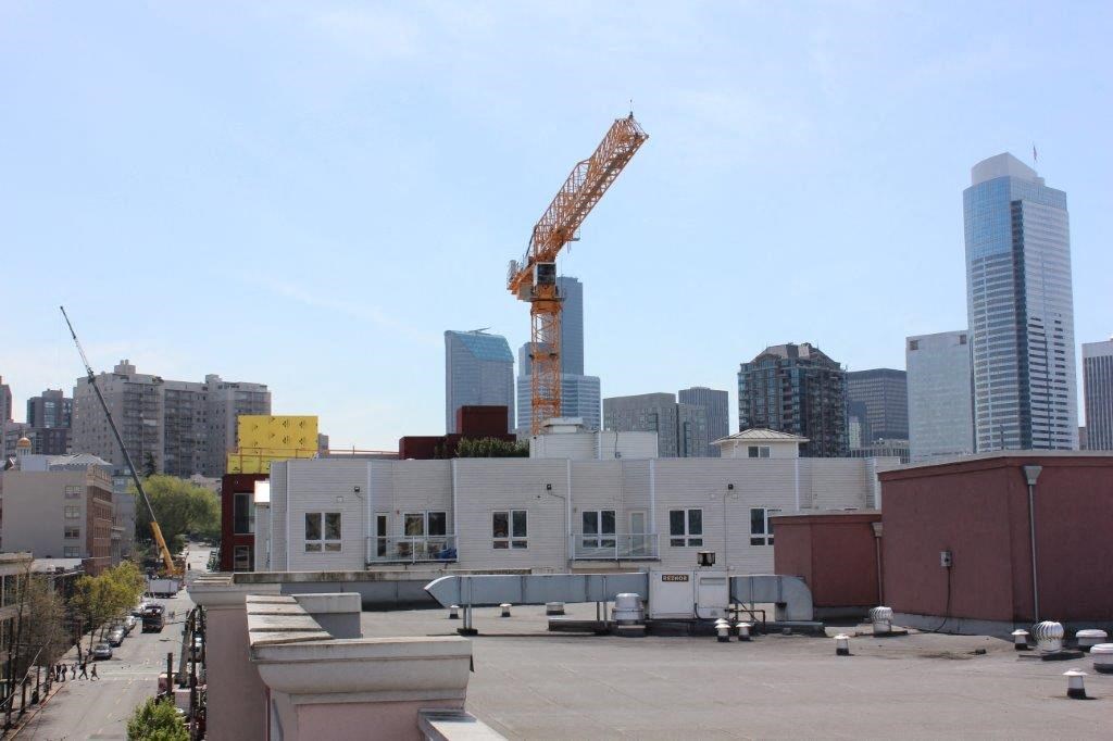 a large white building with a crane on top of it
