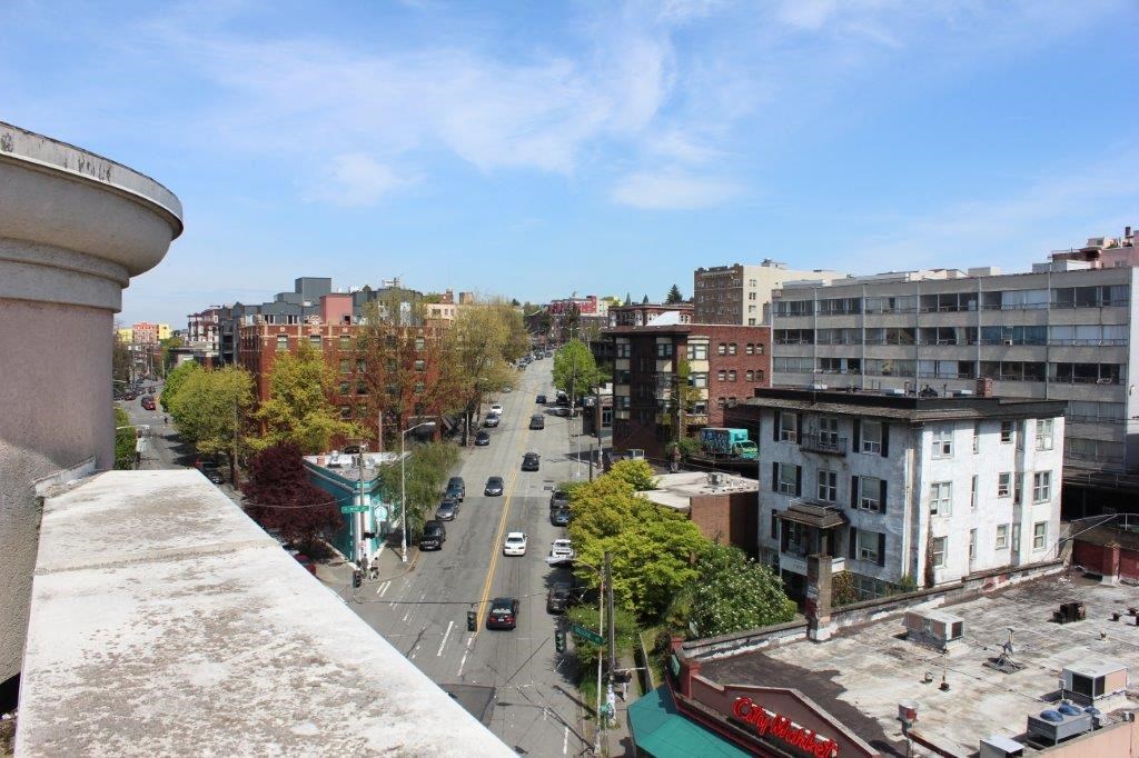 an aerial view of a city street from a roof