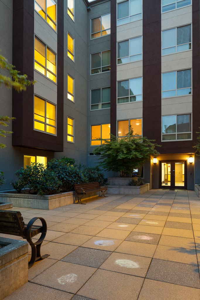 the entrance to an office building at night