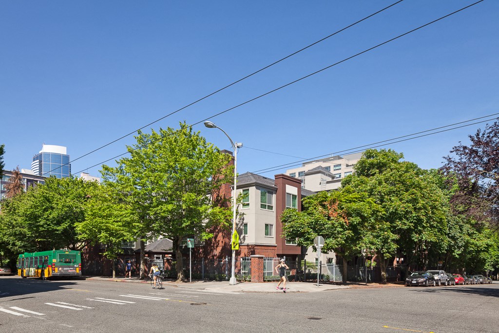 a city street with a bus driving down it