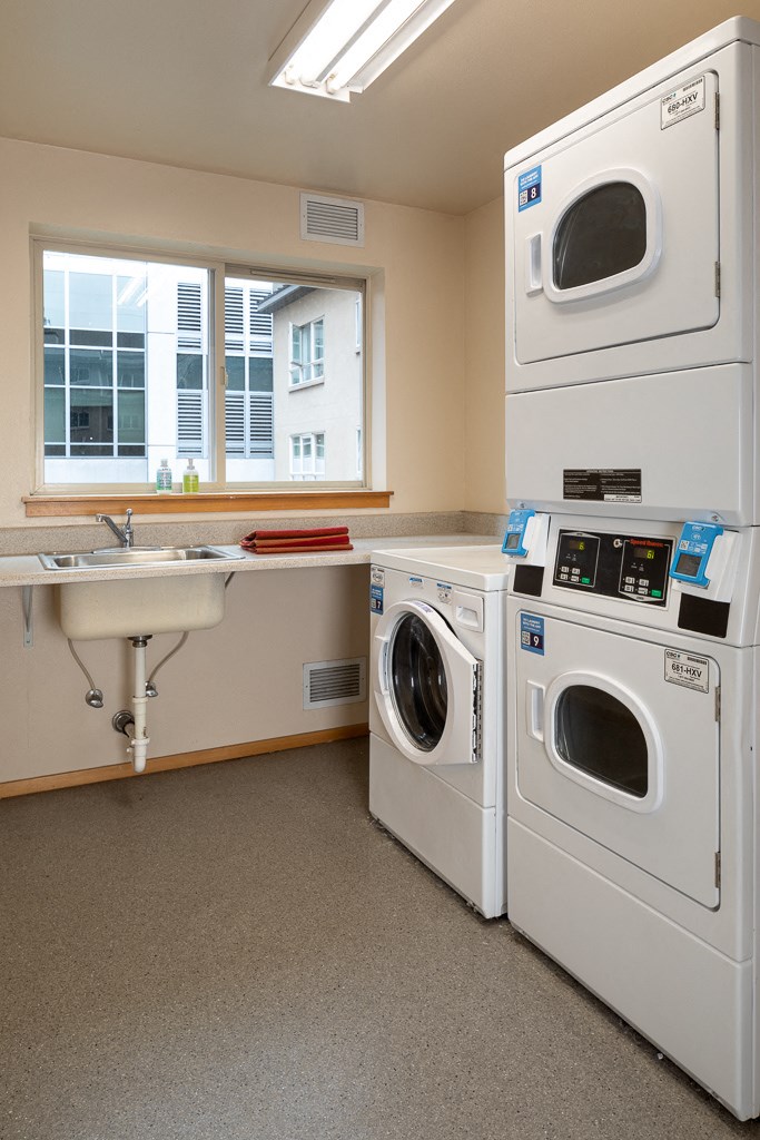 A laundry room with a washer and dryer.