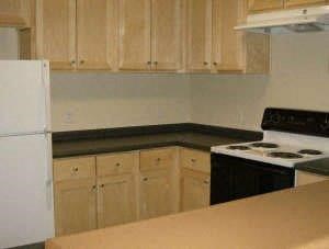 a kitchen with a stove and a refrigerator