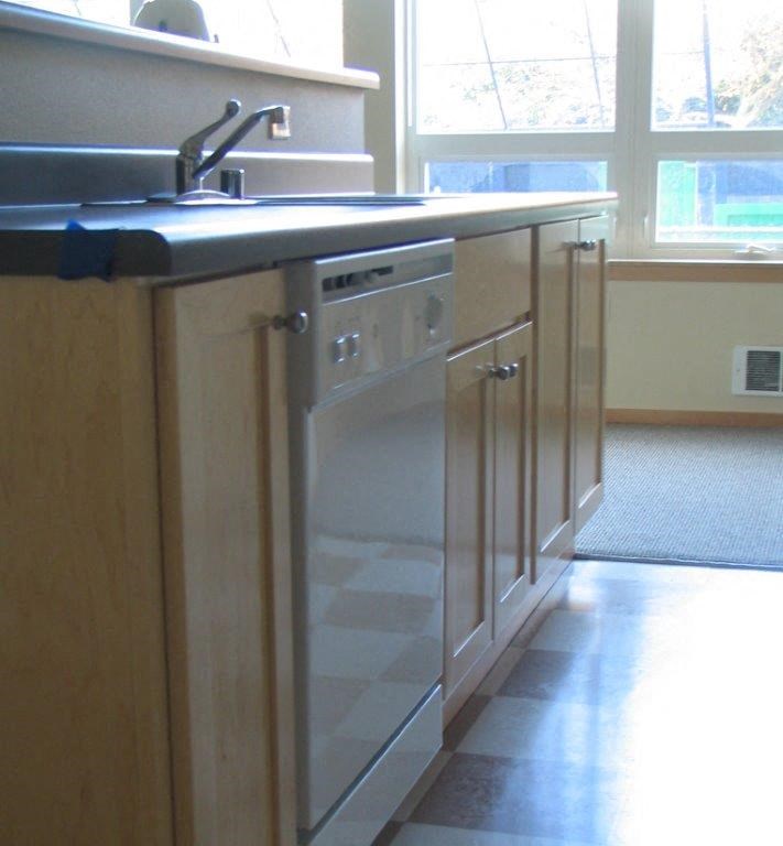 a kitchen with a sink and a dishwasher