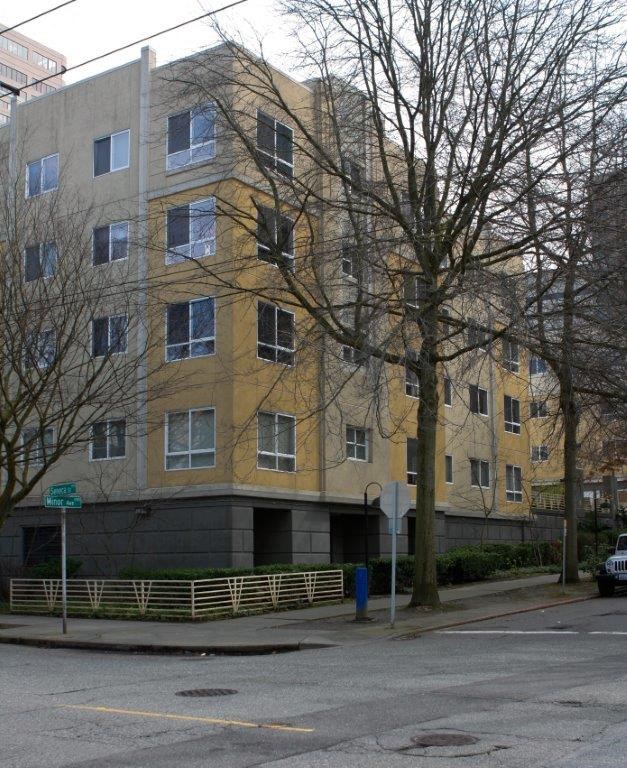 an apartment building on the corner of a street