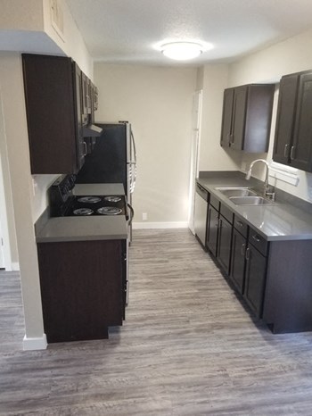 Image of kitchen with cabinets and stainless steel appliances