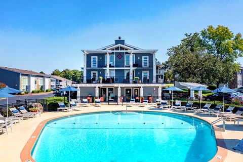 a swimming pool with a building in the background