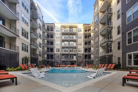 a swimming pool in the middle of an apartment building