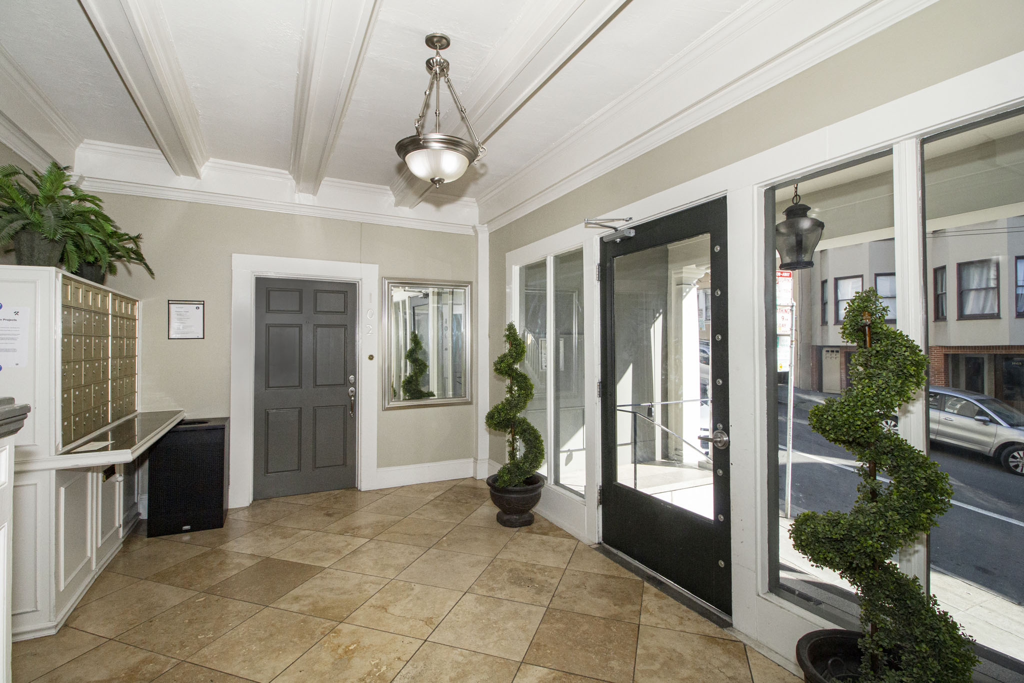 A room with a tiled floor and a ceiling light.