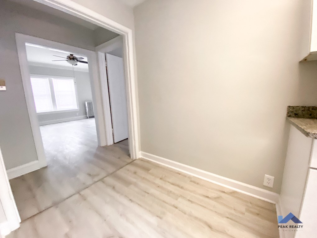 the view from the kitchen into the dining room and the living room