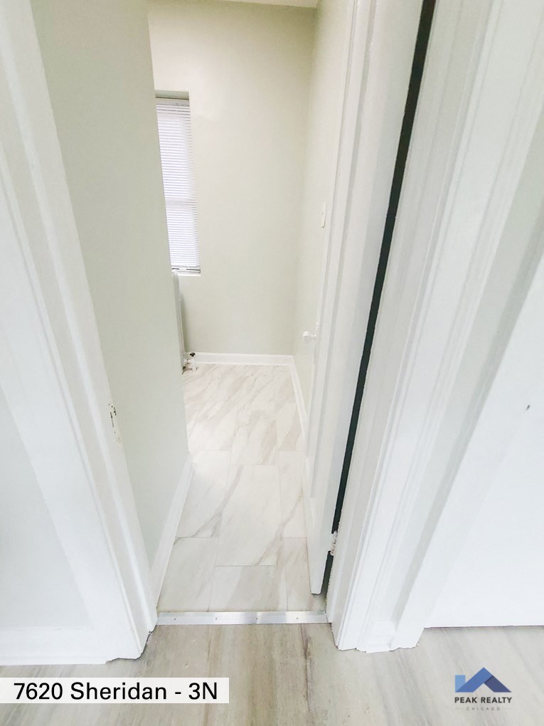 a view of the hallway from the living room into the bedroom