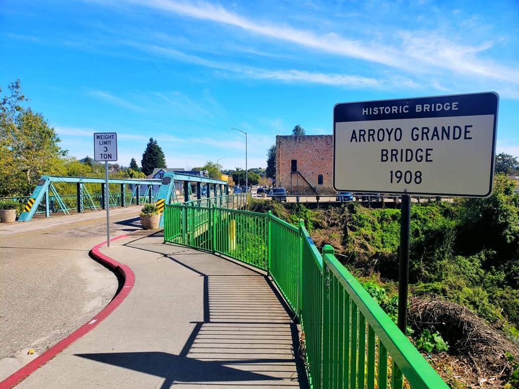 a bridge with a sign that reads airport grange bridge