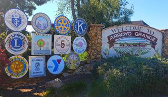 a sign for the welcome to arroyo grande sign with many different signs