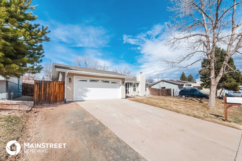 a house with a driveway and a white garage door