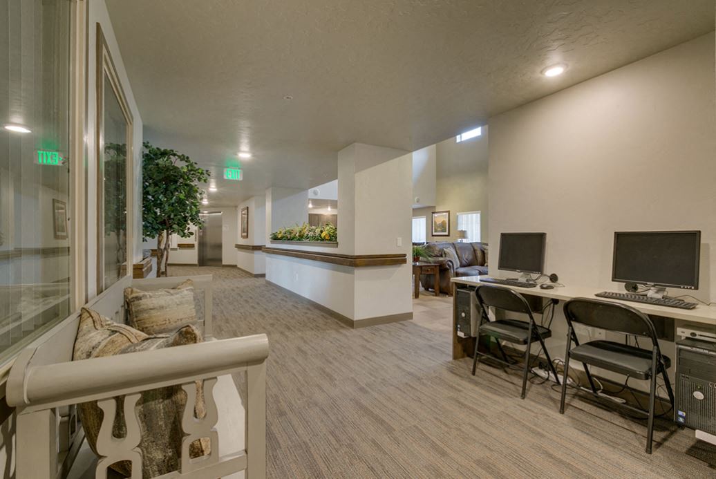 Image of computers with seats and bench