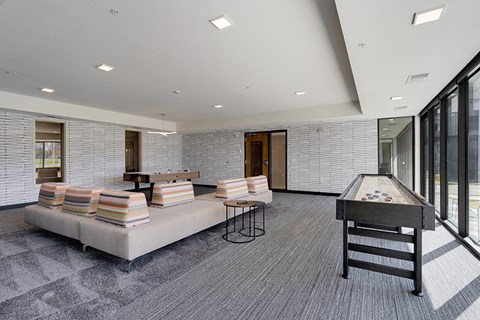 a game room with a foosball table and a pool table